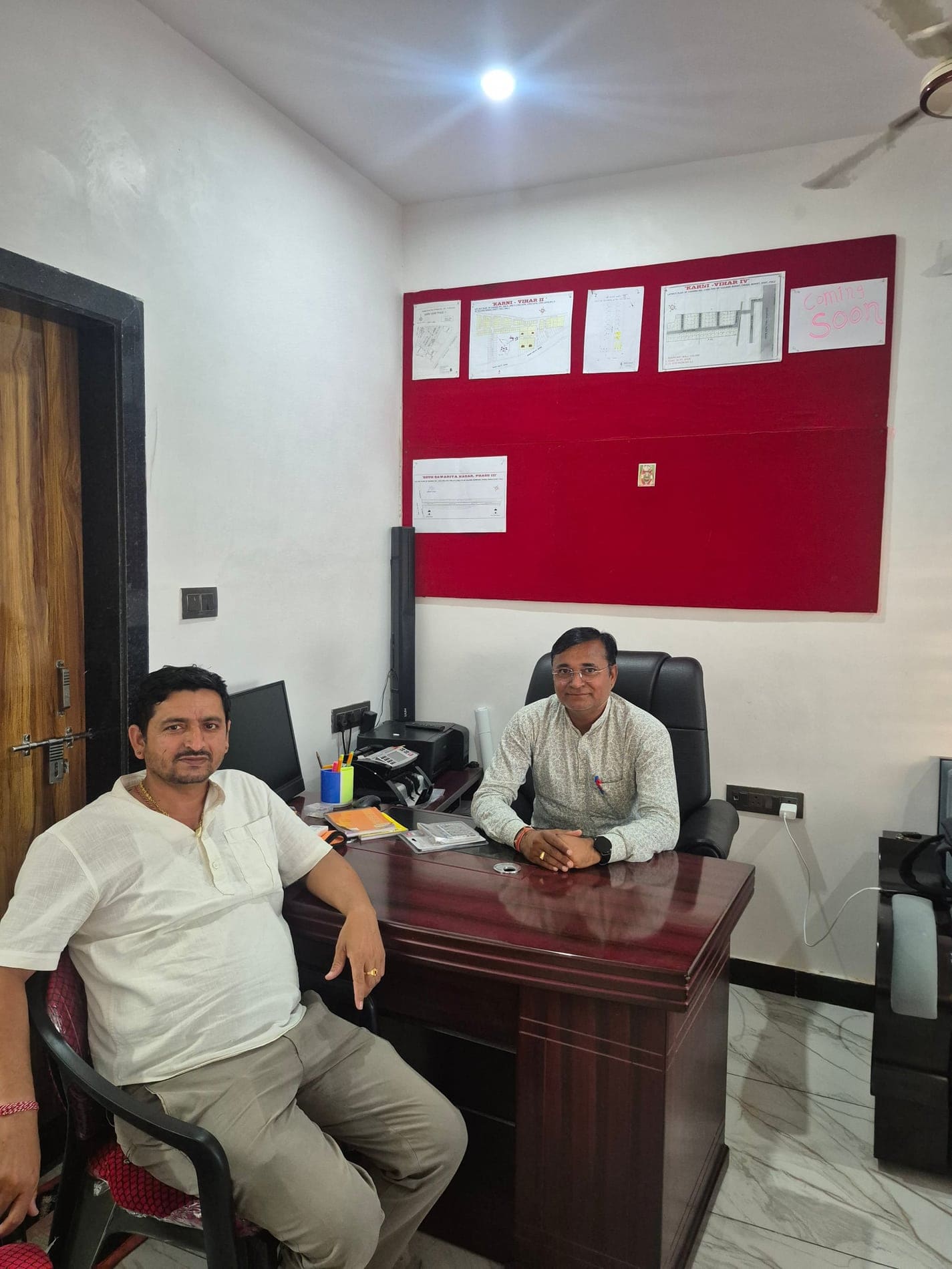 Property planning discussion at the Shree Karni Kripa Properties office